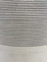 Load image into Gallery viewer, A close-up of a white and gray-striped pot.
